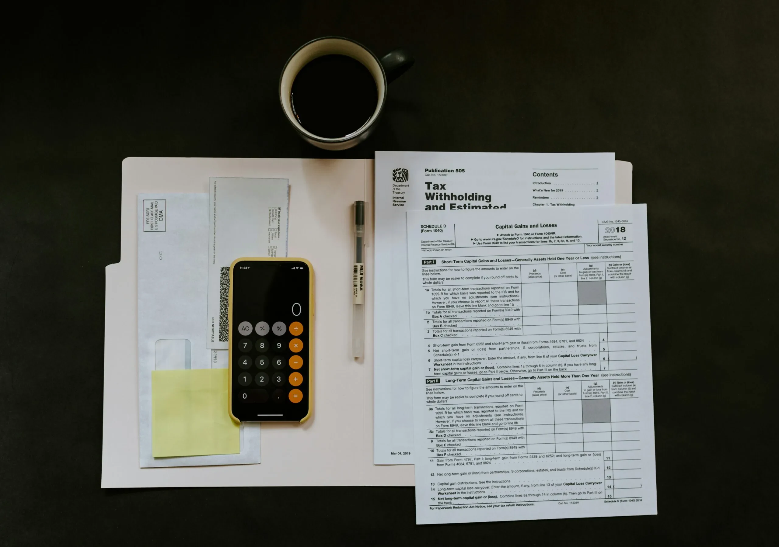 Tax documents and calculator representing payroll contribution planning